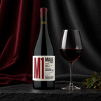 M1 by MABE bottle beside a glass of red wine